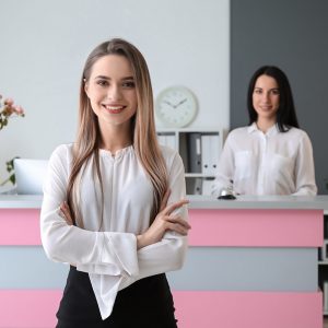 Young female receptionist in hotel